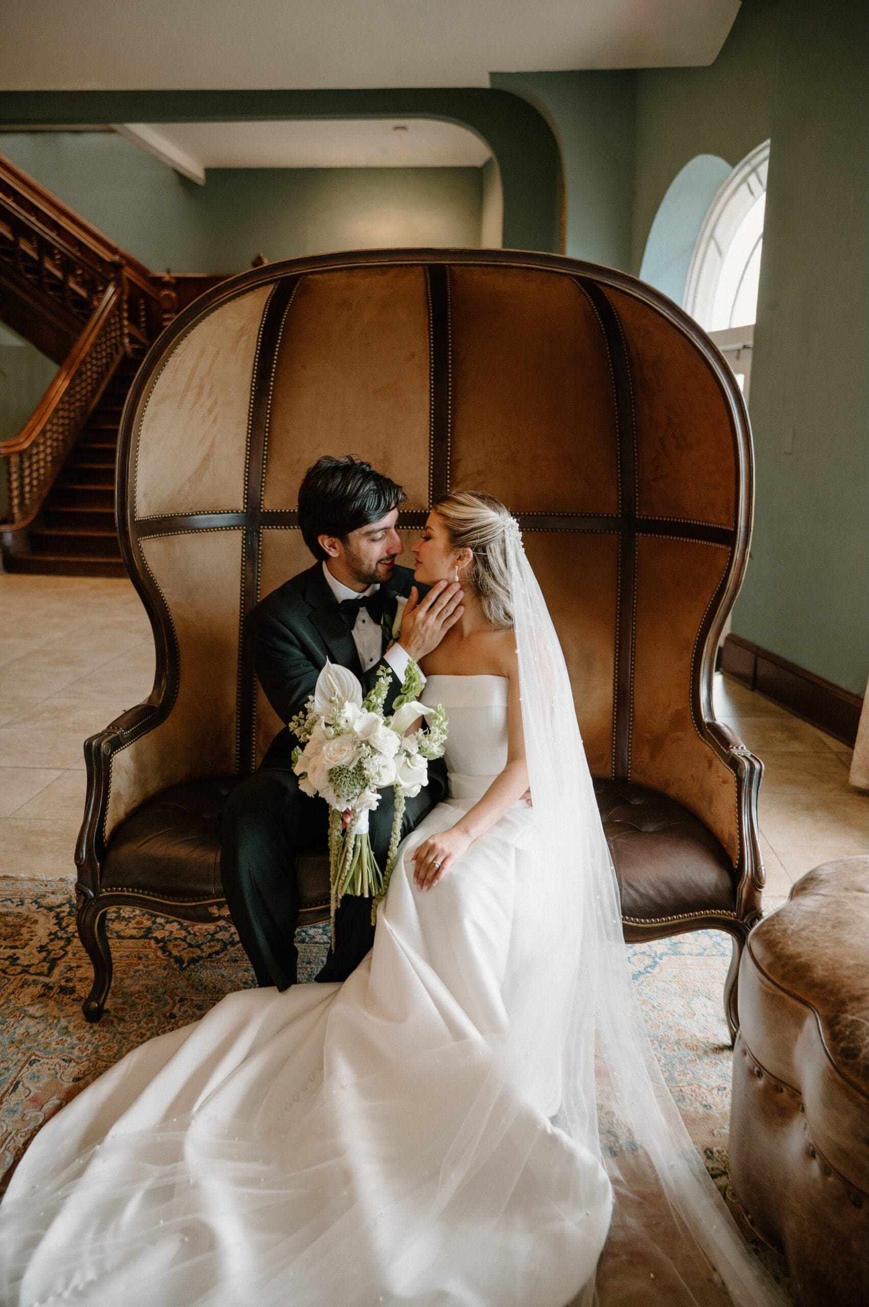 bride and groom gazing at each other as newlyweds